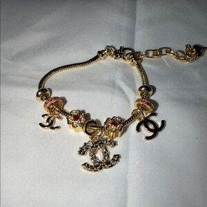 CHANEL Gold and Pink Charm Bracelet